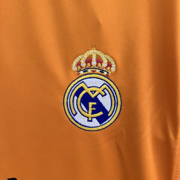 camiseta real madrid 13 14 naranja escudo