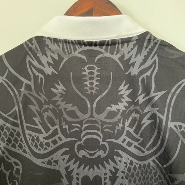 Camiseta Real Madrid negro 2023-2024 Dragon cuello anterior