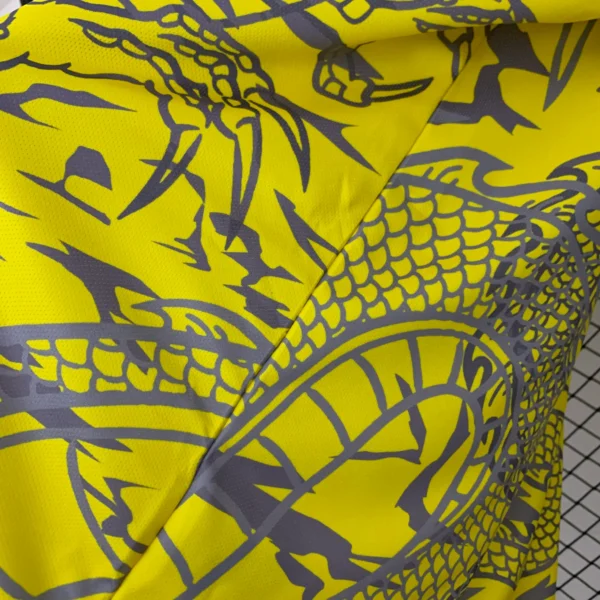 Camiseta amarillo Real Madrid 2025-2026 Dragon lateral