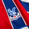 Camiseta Crystal Palace rojo-azul 2025-2026 escudo