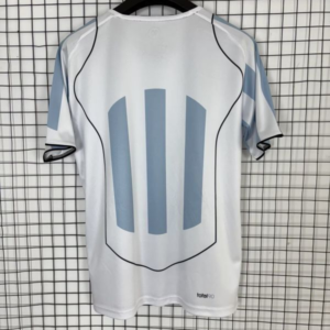 Camiseta Total 90 blanco-celeste 2025-2026 dorsal