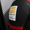 Camiseta Bayer Leverkusen Negro 2024-2025 hombro
